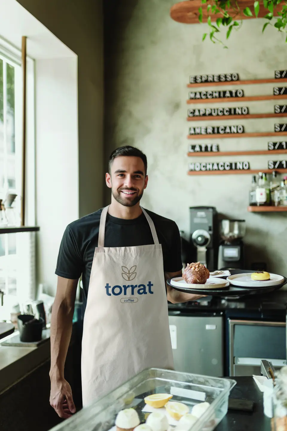 Waiter posing with tray