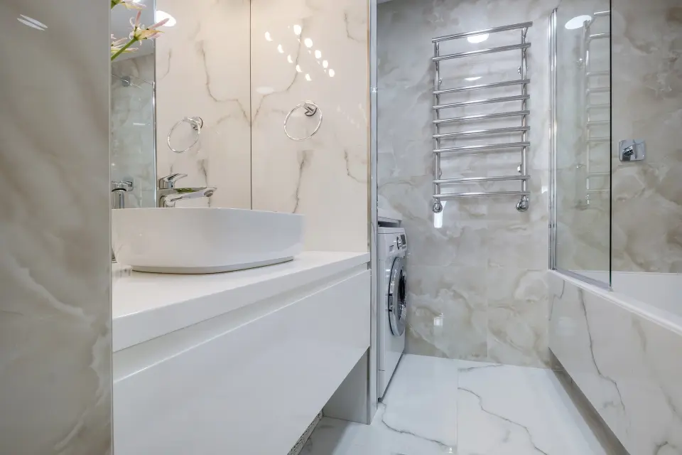 toilet and detail of a corner shower cabin with wall mount showe