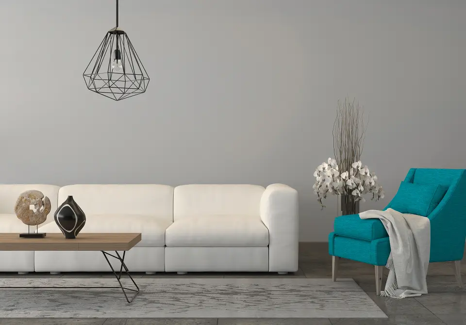 Turquoise armchair with a sofa in the living room